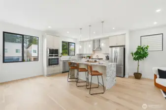Light and bright modern kitchen with contemporary lighting and appliances