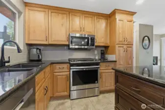 Stainless steel appliances with antique stain oak cabinets