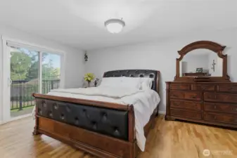 Large primary bedroom with slider to deck
