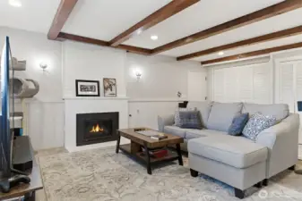 Gas fireplace to lower living are, ceiling has red ceder beams