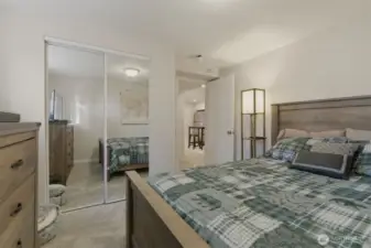 Bedroom #1 to lower level with mirrored closet doors