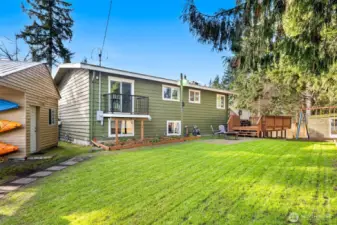 Photo of large backyard and 2 story shed