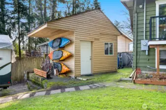 Photo of the 2 storage shed, great place to hang outdoor toys under overhang roof