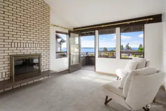 Making the case for space, this sitting area with deck access and a fireplace in the primary suite removes “cramped” from your life’s vocabulary.