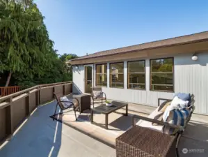 Up on the second tier of the pool house, another deck is the perfect hybrid solution: Catch some rays outside, then glide into the lap pool down below.