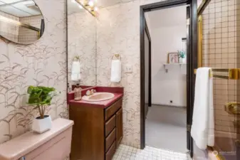 Talk about pretty in pink! The lower floor full bathroom brings artful details to what is normally considered a utilitarian space.