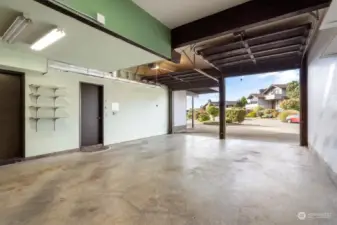 The lower level offers access to the massive garage, a three-car titan with a tall second bay for RV or boat parking. The workbench and cabinetry in the garage are a tinkerer’s delight!