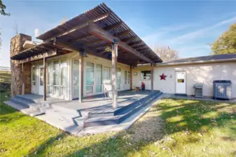 Back view of home and wraparound deck.