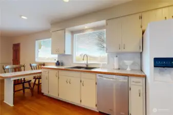 Refrigerator, dishwasher, double sink, breakfast bar.