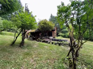 Side yard and view towards pond of the single level home at 818 NW 349th St, La Center WA in Clark County