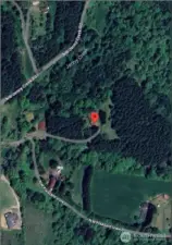 Aerial view of 40 acres with a home in Clark County Washington. One level home and barn included.