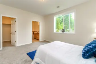 Primary bedroom shows location of closet and bath.