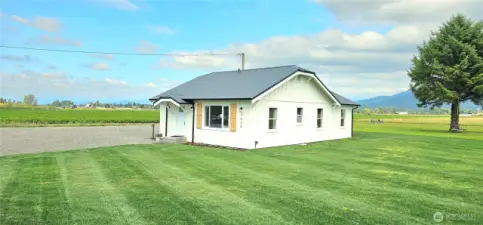 New siding and paint. Metal roof. No, the grass is not photoshopped! Just well take care of around the house.