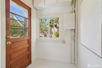Mudroom off kitchen leading to deck and backyard