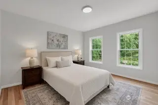 AI generated photo. Seller will replace the downstairs dining room with an additional bedroom by adding a wall/door.