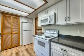 Unit A Kitchen - Recently Remodeled, New Cabinets, Countertops, Sink, Stove, Microwave, and Refrigerator