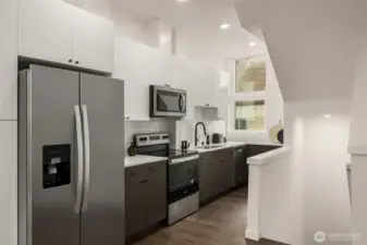 New stainless steel appliances and quartz countertops