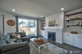 LIVING ROOM WITH SLIDING GLASS DOOR ON TO BACK PATIO