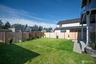 FULLY FENCED BACKYARD WITH 2 GATES AND BACK PATIO