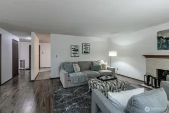 Family room with view of door to the upstairs loft on the left, and garage door straight ahead