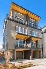 Discover timeless elegance in this thoughtfully designed home. Enjoy the seamless indoor-outdoor connection with balconies and large windows framing every floor. Imagine yourself relaxing in this contemporary sanctuary.