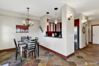 Looking back from the dining room to the door from the hallway.