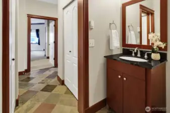 Black granite is featured on both vanities.