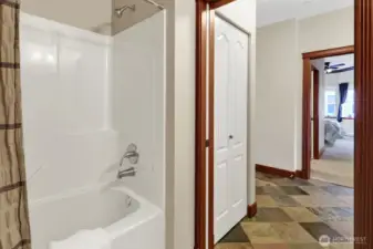 A fiberglass tub/shower combination is featured.