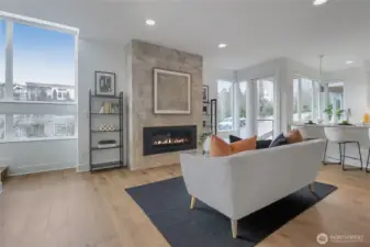 Hardwood floors harmonize with stone and natural light.