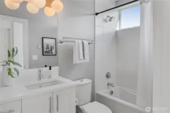 Well-appointed full bathroom with tub and shower.