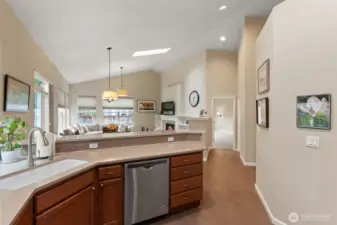 When building the owner had the wall separating the living room and hallway taken down to the same height as the mantel to open the space up even further.