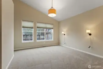 Primary bedroom. NEW CARPET AND NEW SCONCES .