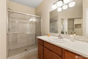 When built owner had the tub/shower replaced with a walk in tiled shower. Quartz counters.