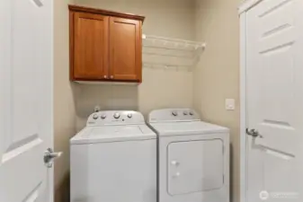 Laundry room/garage entrance. Washer and Dryer may convey with purchase.