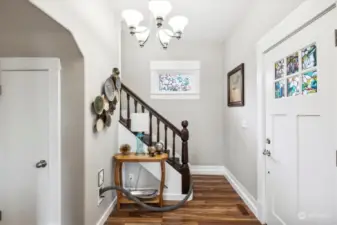 Entry is inviting and offers ample light with extra hall closet close by.