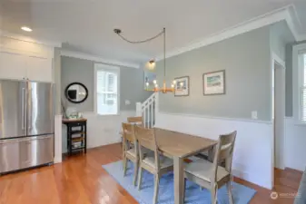 The large dining table is perfect to enjoy meals and also a great place for game night!