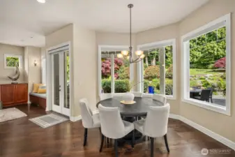 This lovely kitchen dining nook is flooded with morning sun