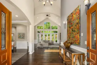 Welcome home with this extraordinary greeting! Refined finishes, impressive architectural design, lofty ceilings and serene sunny views will delight everyone who walks through these doors.