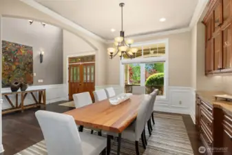 Warm hardwoods, coved ceilings, fine mill work and beautiful built-ins punctuate the formal dining room. The powder room is around the corner