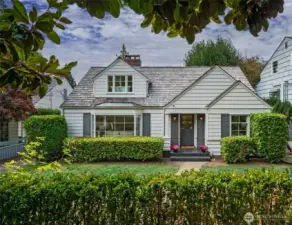 Welcome to this darling Cape Cod home on the cutest one-way street!