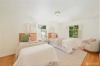 One of the two main floor bedrooms-- this one is quite large- room for a king sized bed- could be a main floor primary bedroom