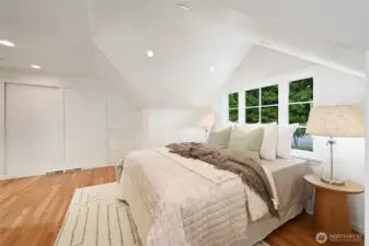 Another view of the bedroom shows the large closet and built ins. The back wall also has additional built ins for more storage