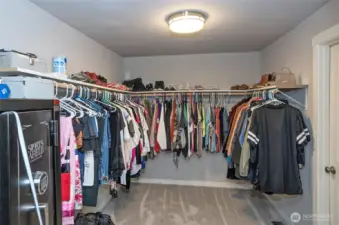 Expansive walk-in closet keeps everything neatly organized