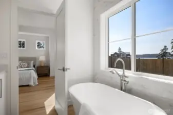 The large soaking tub takes in the water views as well as the incredible sunsets.