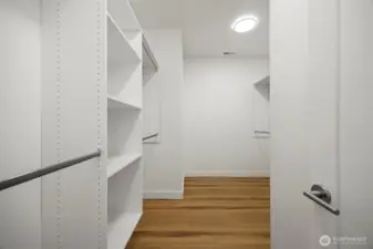 The walk-in closet is generously sized and has built-in finishes.