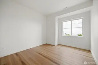 The third bedroom is also generously sized and looks to the side yard.