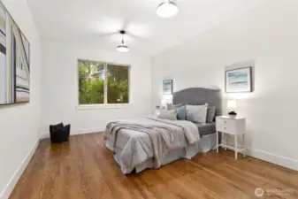 Generous bedroom on the main level with views of the park like backyard