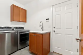 Convenient laundry/mudroom on the main level.  Garage access through door straight ahead!
