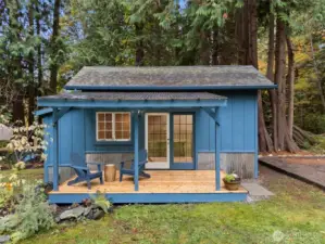 Insulated Outbuilding with Power and Covered Deck.