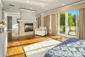 Large primary retreat with double fireplace with privte deck access